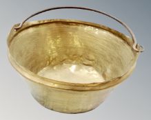 A 19th century brass cast iron swing handled pan,