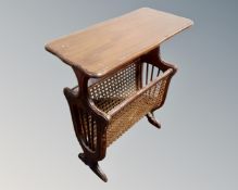 A reproduction bergere magazine table