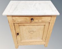 A pine marble topped wash stand fitted a cupboard and drawer