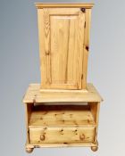 A pine television stand fitted a drawer together with a wall cabinet