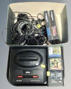 A Sega Mega drive II together with five games, Sonic, Sonic II, Road rash III,