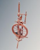 A 20th century beech wood spinning wheel