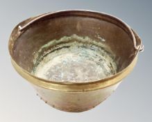 A 19th century brass cast iron swing handled jam pan,