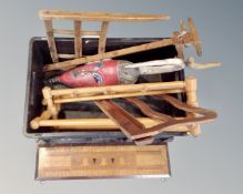 A box of wooden pieces, marquetry panel, wall mask, music stand,