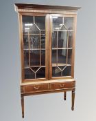 A 20th century Scandinavian bookcase on raised legs