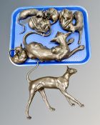 Six resin cat figures together with two further pottery figures.