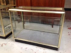 A metal framed shop display cabinet with internal shelf (one door),
