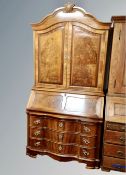 A Scandinavian walnut bureau bookcase with three drawers