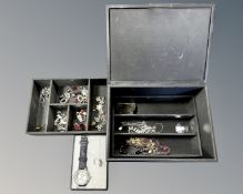 A jewellery box containing costume jewellery,