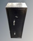 A metal gun cabinet with keys