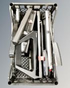 A tray of office long arm staplers and hole punches