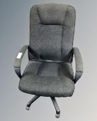 A black fabric upholstered swivel office chair