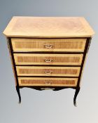 A French marquetry inlaid four drawer chest with ormolu mounts