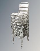A set of eight aluminium stacking bistro chairs