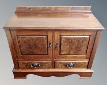 An Edwardian mahogany double door linen cabinet with two drawers