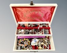 A jewellery box containing costume jewellery,