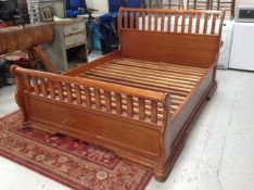 A contemporary 5' sleigh bed