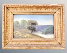 An antiquarian oil on card depicting a boat on river in rural landscape in gilt frame