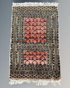 An Iranian prayer rug, 58cm by 86cm.