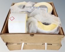 Seven large rolls of adhesive labels.