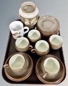 A tray containing six Denby pottery trios together with a further Denby mug and vase.