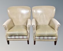 A pair of armchairs in studded beige vinyl