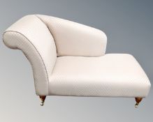 A half size Victorian style chaise longue upholstered in a pink fabric