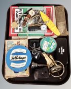 A tray containing assorted lady's and gent's wristwatches, a trumpet mouthpiece, fishing line,