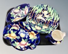 A tray containing Maling wall plaque depicting ducks in flight together with three further pieces