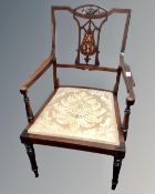 An Edwardian inlaid mahogany open armchair