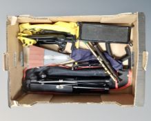 A box of folding music stand, metronome, guitar stand,