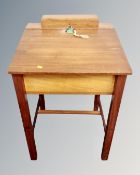 A 20th century clerk's desk on raised legs
