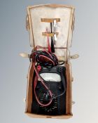 A vintage Bakelite cased avometer in leather case