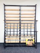 A 5' wrought metal bed frame