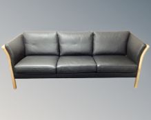 A late 20th century Scandinavian black leather three seater settee