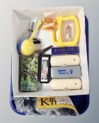 A tray containing assorted mouth organs including Hohner and Suzuki examples,