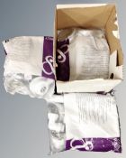 A box containing Cooke and Lewis kitchen plumbing kits.