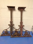 A pair of cast iron table supports