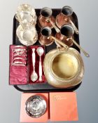 A tray of assorted metal wares, four graduated copper measures, plated toast rack,