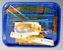 A tray containing a quantity of drawing stencils