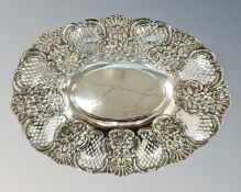 An Edwardian pierced silver dish with repoussé floral decoration, George Nathan & Ridley Hayes,