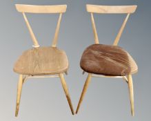 A pair of Ercol stick back stackable dining chairs