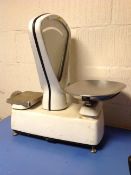 A set of vintage enamelled Avery grocer's scales