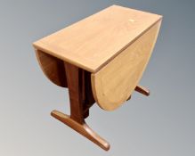 A 20th century Nathan teak flap sided coffee table