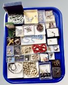 A tray of vintage and later costume jewellery, brooches, crucifixes on chains,