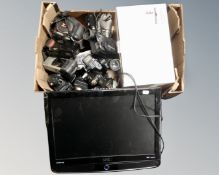 A UMC 19 inch LCD TV together with a box containing Sainsburys two-slice toaster, assorted cameras,