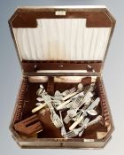 A 20th century canteen containing miscellaneous stainless steel and plated cutlery.