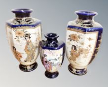 A pair of Japanese Satsuma vases together with a further Japanese vase.