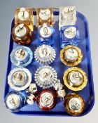 A tray containing fifteen glass Art Deco table lighters