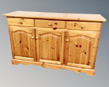 A pine contemporary triple door sideboard